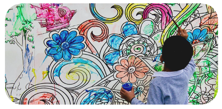 Child painting flower mural