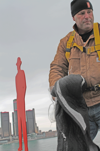 Artist John Sauve installs Man in the City sculpture - 2013
