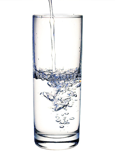 Water glass being filled