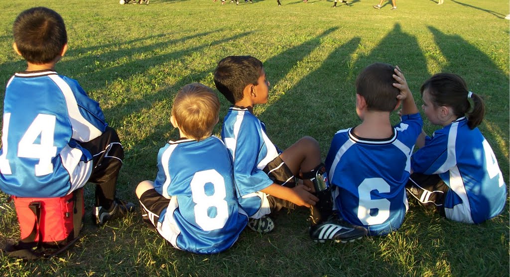Boys and girls in soccer uniforms