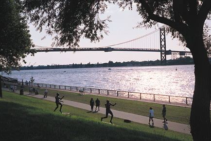 Riverfront path through the sculpture park with Ambassador Bridge in background