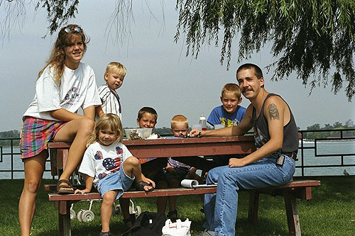 Family picnic along the riverfront