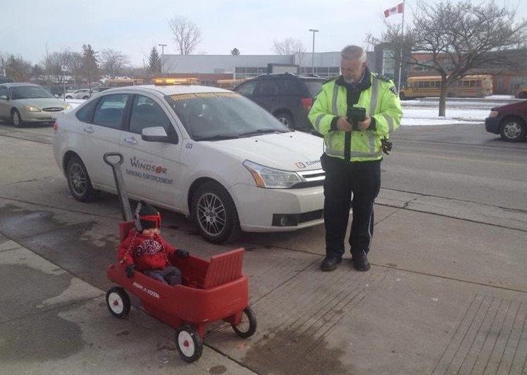 Ticket officer pretending with a child in a wagon