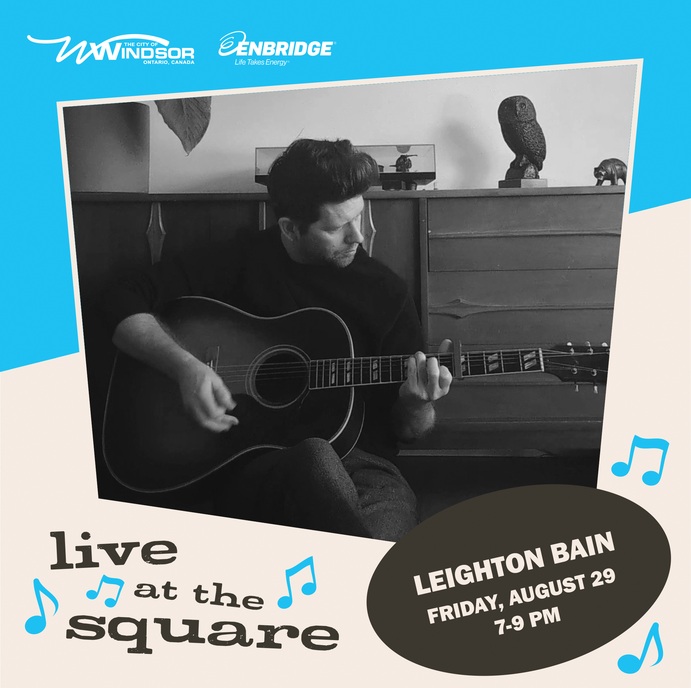 Musician Leighton Bain holding an acoustic guitar