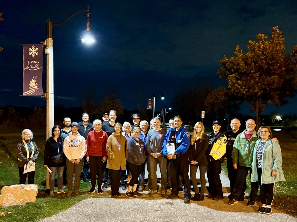 Residents gathered in a park in LaSalle at night